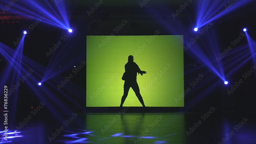 People Dancing In front of projection lights against canvas People Dancing In front of projection lights against canvas