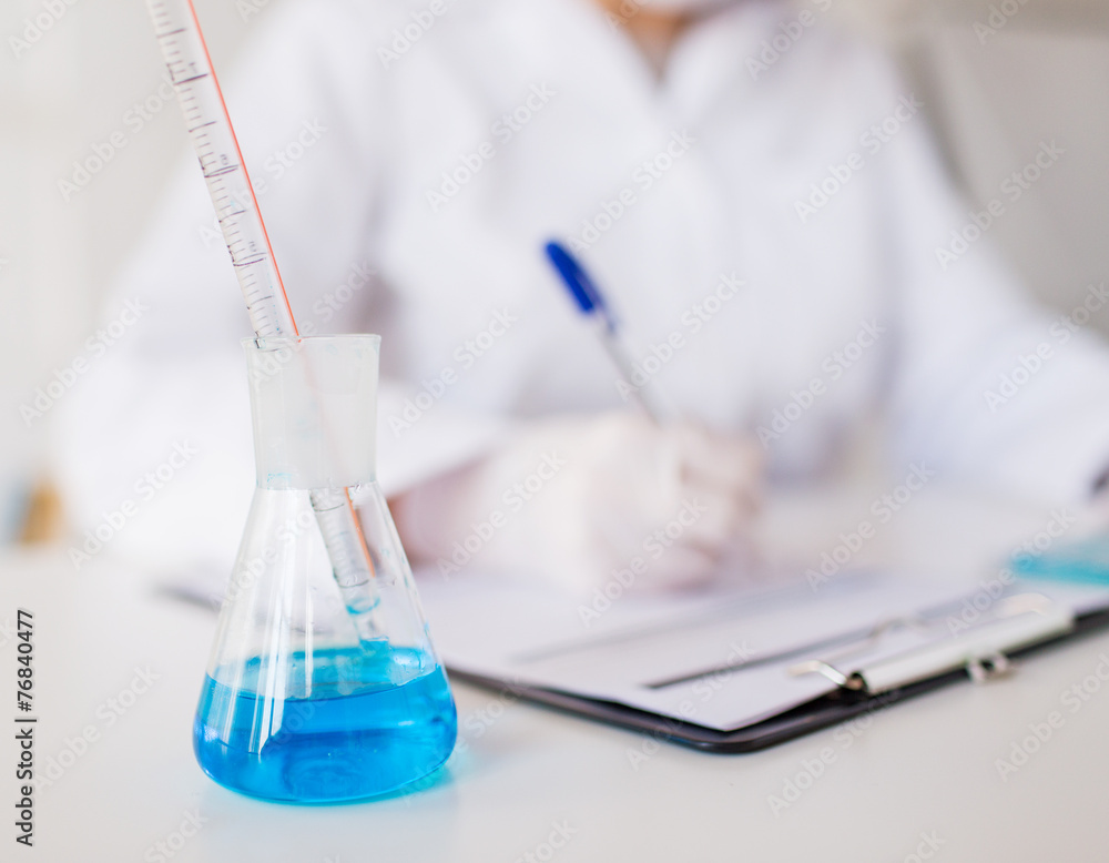 close up of scientist making test in laboratory close up of scientist making test in laboratory