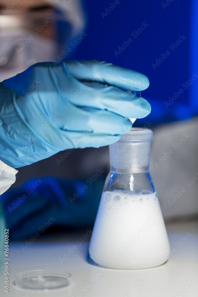 close up of scientist making test in lab