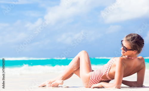 long haired girl in red swimsuit on tropical caribbean beach © el.rudakova