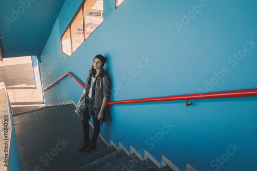 Pretty girl posing in a metro station