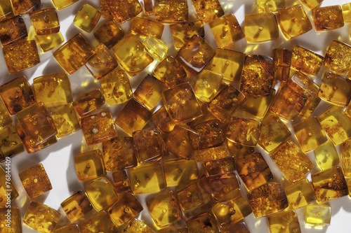 yellow amber stones rectangular closeup lie on a flat surface © andrew  Go