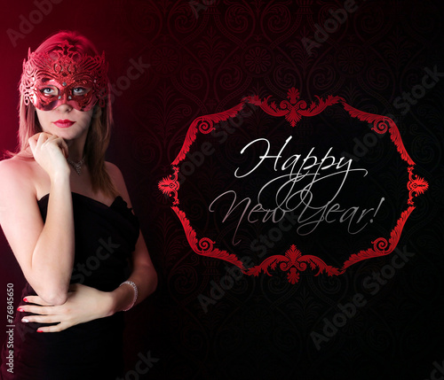 Beautiful girl in a carnival mask and Happy New Year wishes