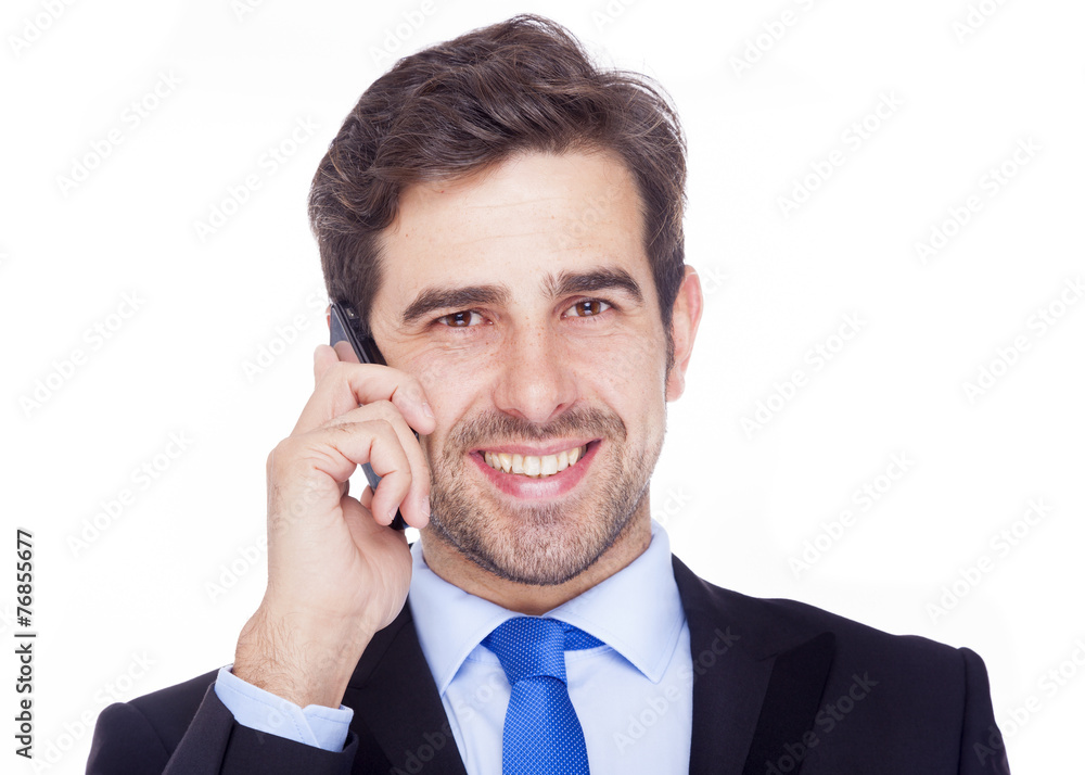 Handsome business man talking on the phone, isolated on a white Handsome business man talking on the phone, isolated on a white