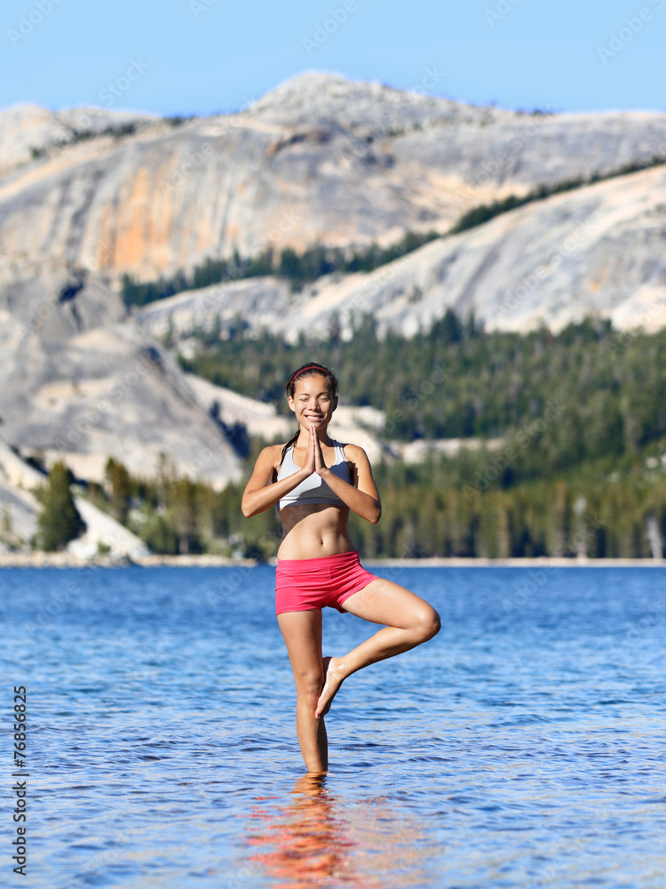 Yoga meditation woman meditating in nature lake