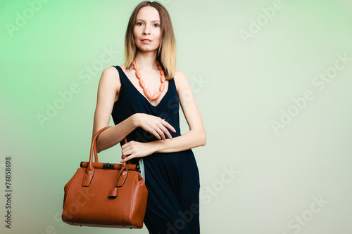stylish woman fashion girl holding brown handbag