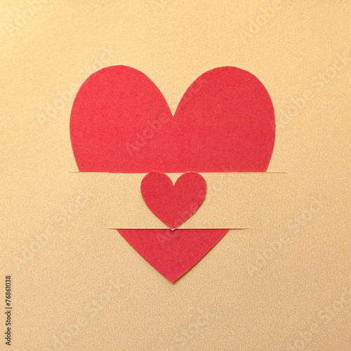 Paper hearts on gold paper background