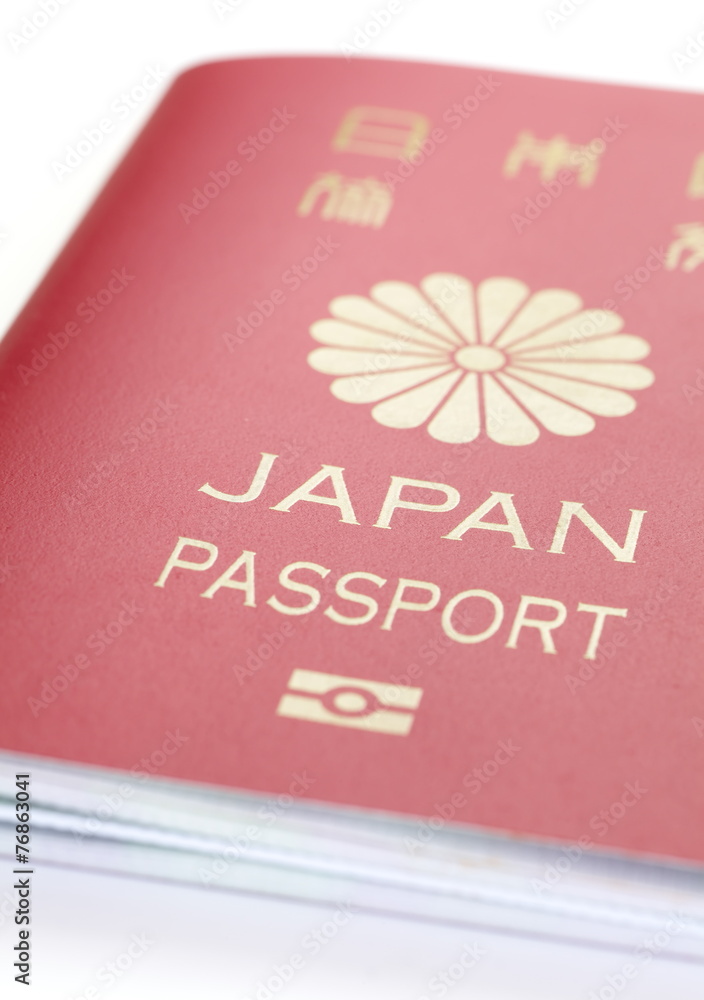 Close - up Japanese passport on white background Close - up Japanese passport on white background