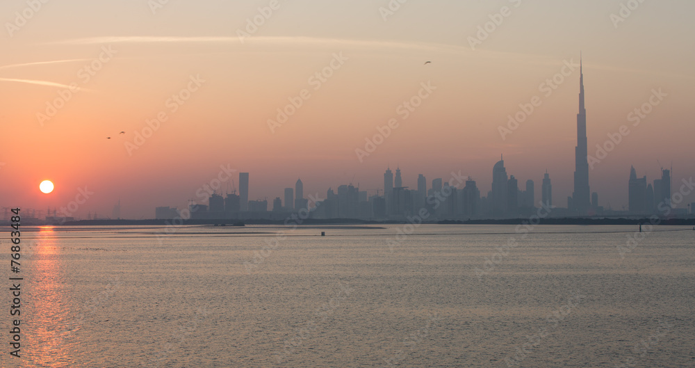 Dubai skyscraper and Burj Khalifa at sunset