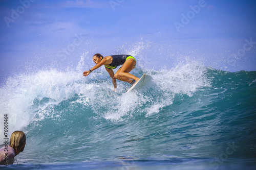 Surfer girl on Amazing Blue Wave © trubavink