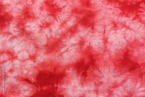 red tie dye fabric background photo