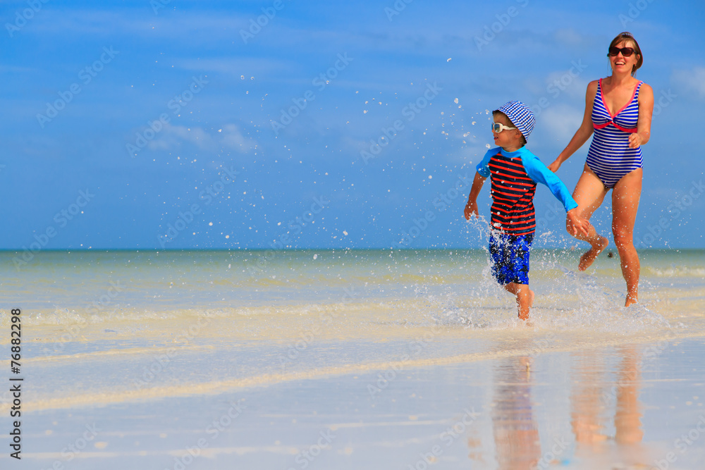 Fototapeta premium mother and son running on the beach