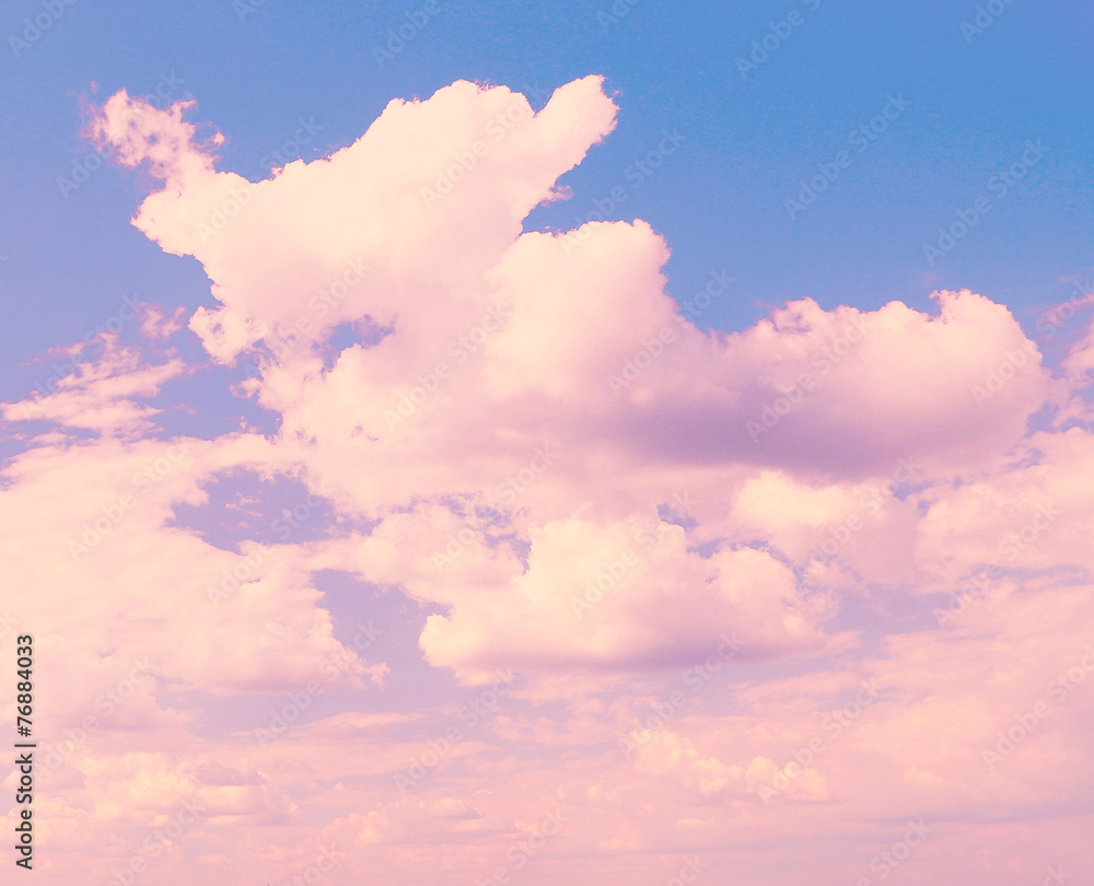 Blue sky background with pink clouds