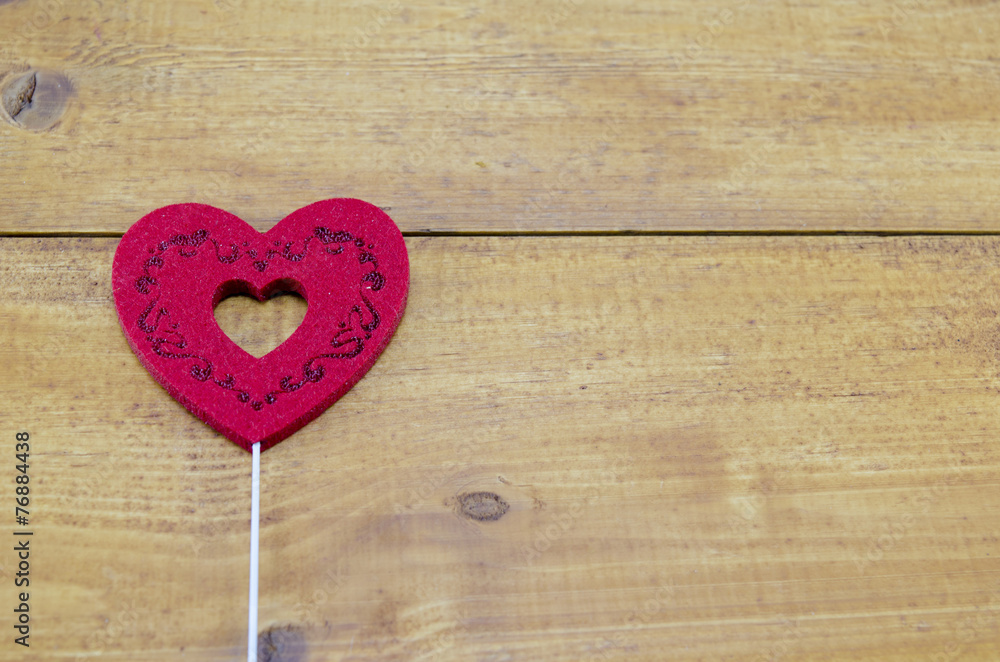 Red engraved heart on a table Red engraved heart on a table