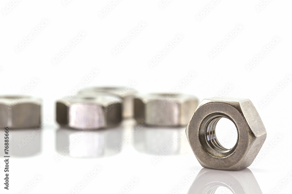 Metal nuts on white background. Metal nuts on white background.