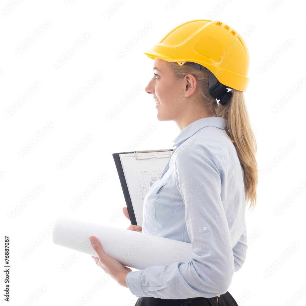 side view of dreaming business woman architect in builder helmet side view of dreaming business woman architect in builder helmet