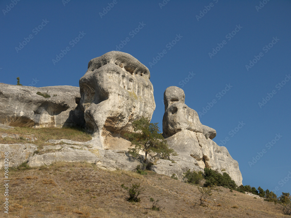 unusual white limestone rock on a background of blue sky