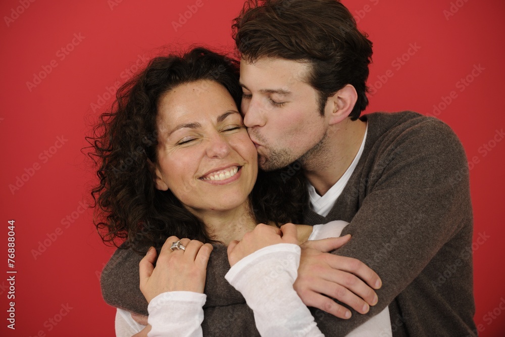 Happy couple on red background in love Happy couple on red background in love