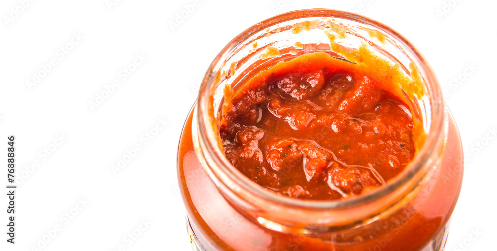 Spaghetti sauce in a jar over white background Spaghetti sauce in a jar over white background