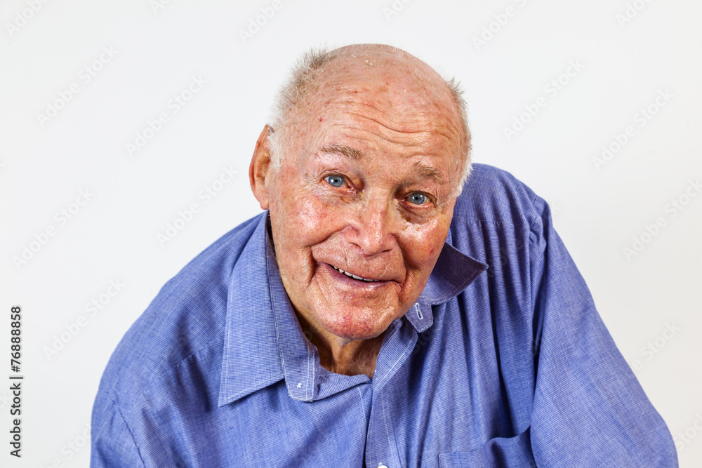 happy elderly man sitting in a chair happy elderly man sitting in a chair