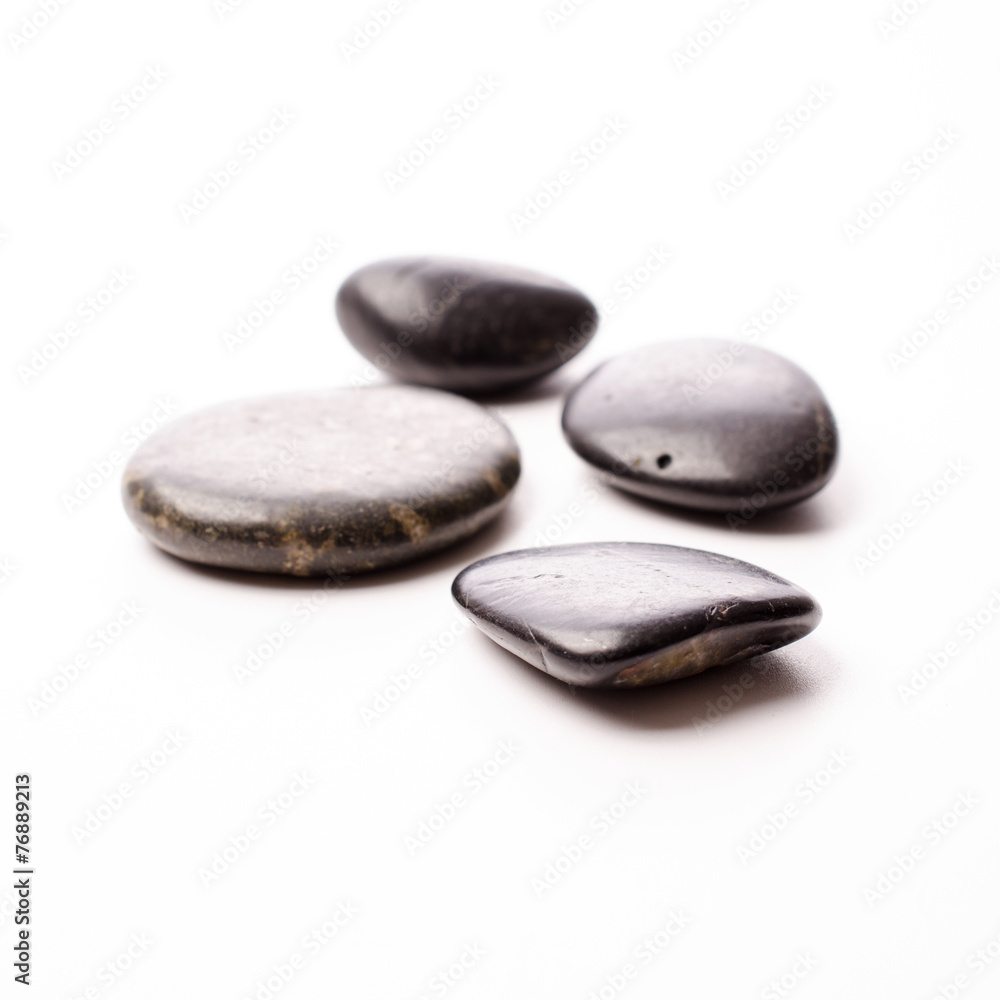 Fototapeta premium Massage stones on white