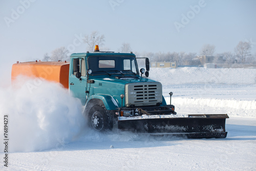 Snowplow is cleaning a road