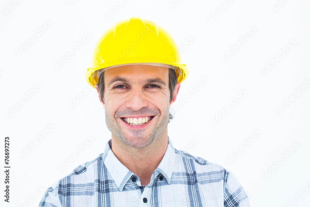 Architect wearing hardhat over white background Architect wearing hardhat over white background