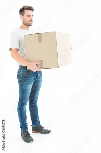 Delivery man carrying cardboard box
