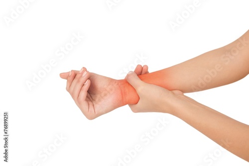 Quadro su tela Close up of a young woman touching her wrist