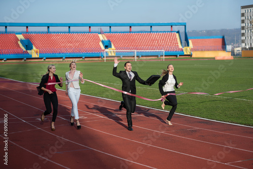 business people running on racing track