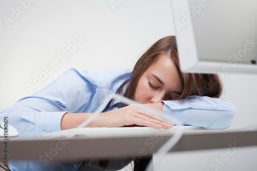 Beautiful woman tired at work