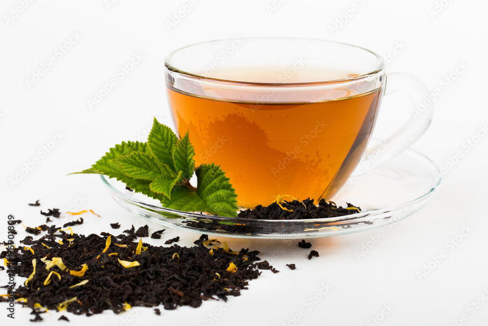 Glass Cup Tea with camomile flower and Mint Leaf, on white Glass Cup Tea with camomile flower and Mint Leaf, on white