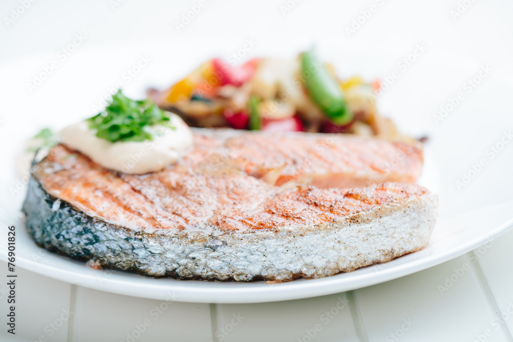 Grilled Salmon with Fresh vegetables on white background Grilled Salmon with Fresh vegetables on white background