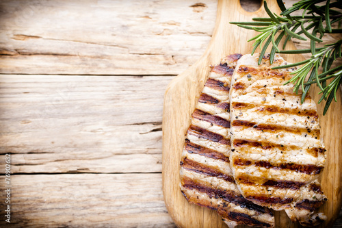 Grilled pork chops pieces. Spices and rosemary.