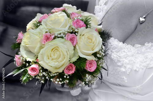 Bride wedding flowers bouquet with roses and green leaves