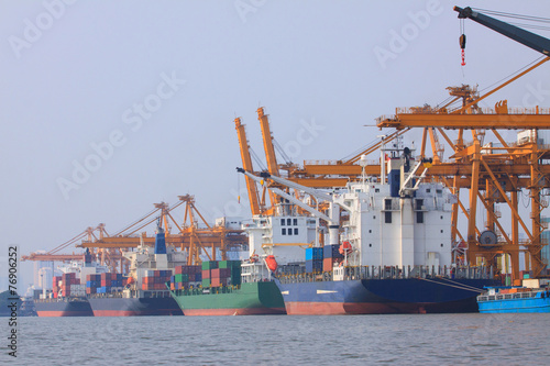 commercial container ship on port use for water transport and sh