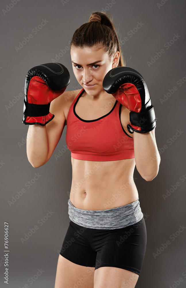 Kickbox young woman in gloves