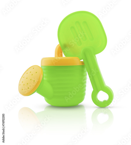 Child's plastic watering can isolated on white background