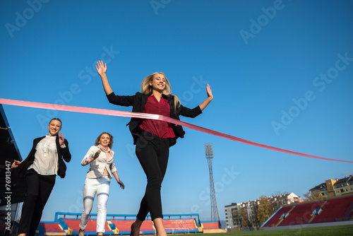 business people running on racing track