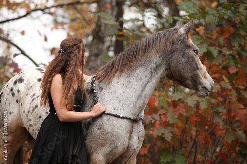 Pretty woman with appaloosa horse in autumn © Zuzana Tillerova