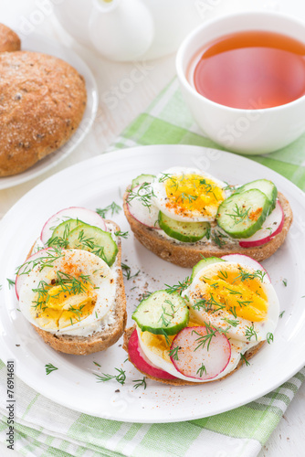 buns with boiled egg and vegetables, vertical