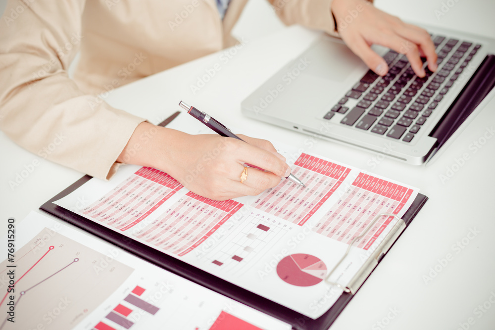 woman hand with business report woman hand with business report