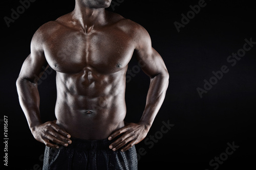 Torso of a muscular man with copyspace
