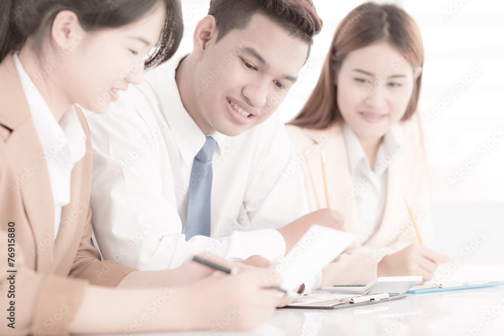 Business people discussing the charts and graphs showing the res Business people discussing the charts and graphs showing the res