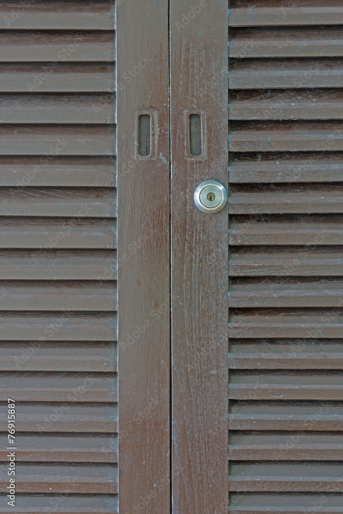 Slatted dirty wooden door