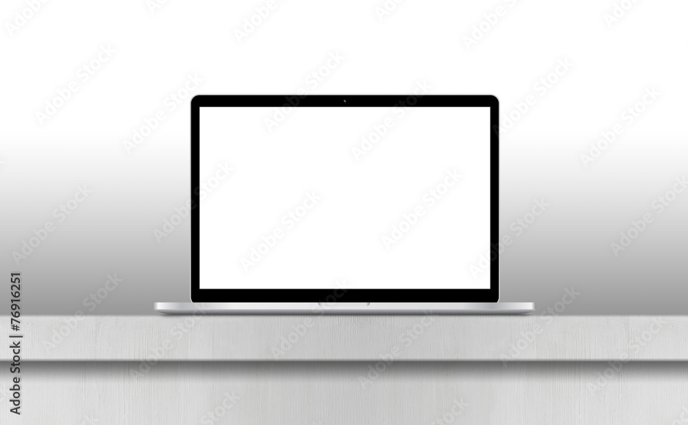 Laptop with blank screen on desk in office interior. Laptop with blank screen on desk in office interior.