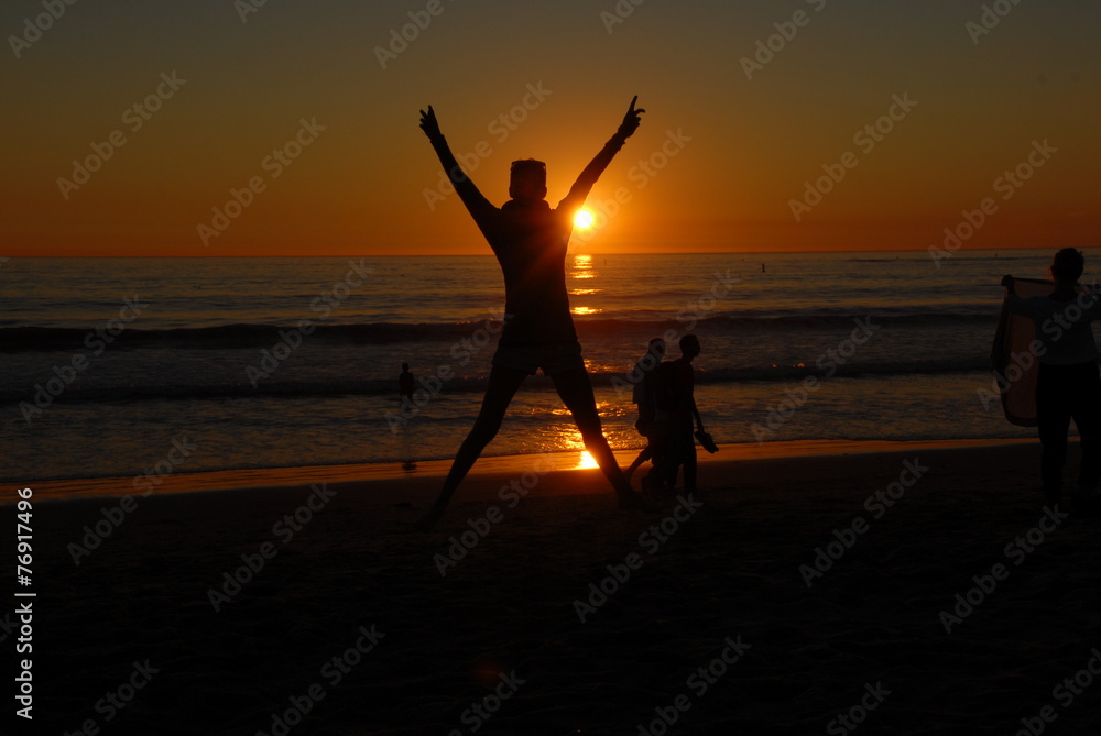 Fototapeta premium jumping girl at sunset