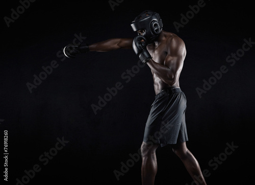 Young boxer exercising © Jacob Lund