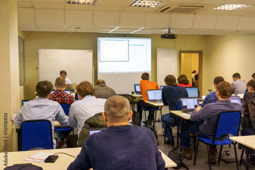 people sitting rear at the computer training class people sitting rear at the computer training class
