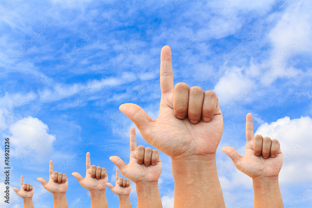Photo of any hand pointed into the clear blue sky Photo of any hand pointed into the clear blue sky